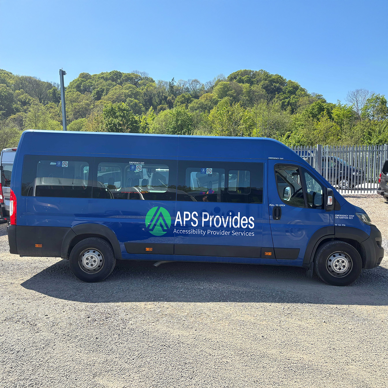 Urban street with APS Provides van and visible signage for aps provides